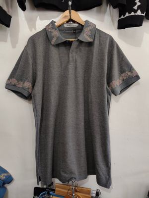 Polo. TBOLI HAND- EMBROIDERED POLO