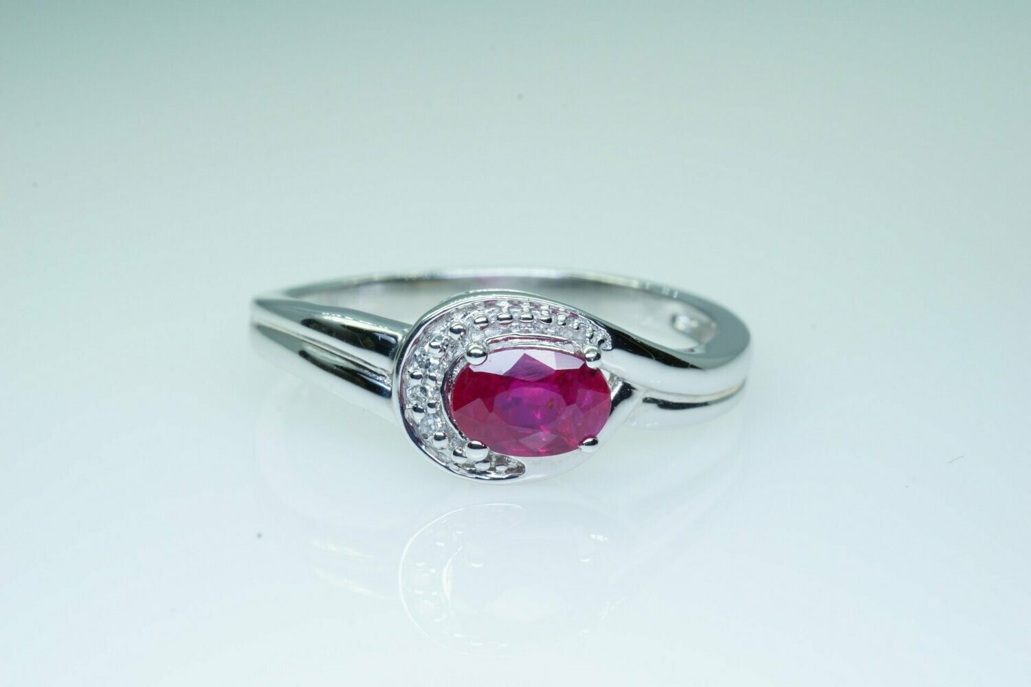 Ladies Genuine Oval Ruby With Diamond Accent