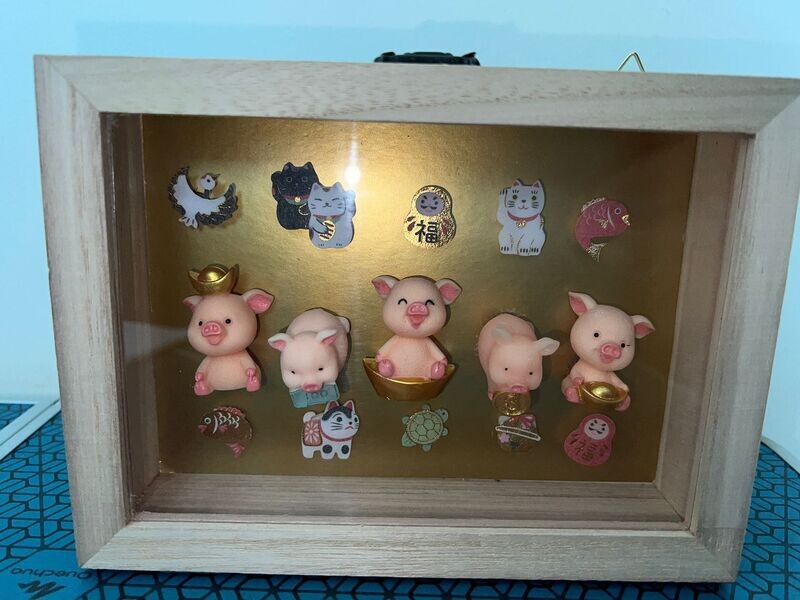 The five lucky pigs display
