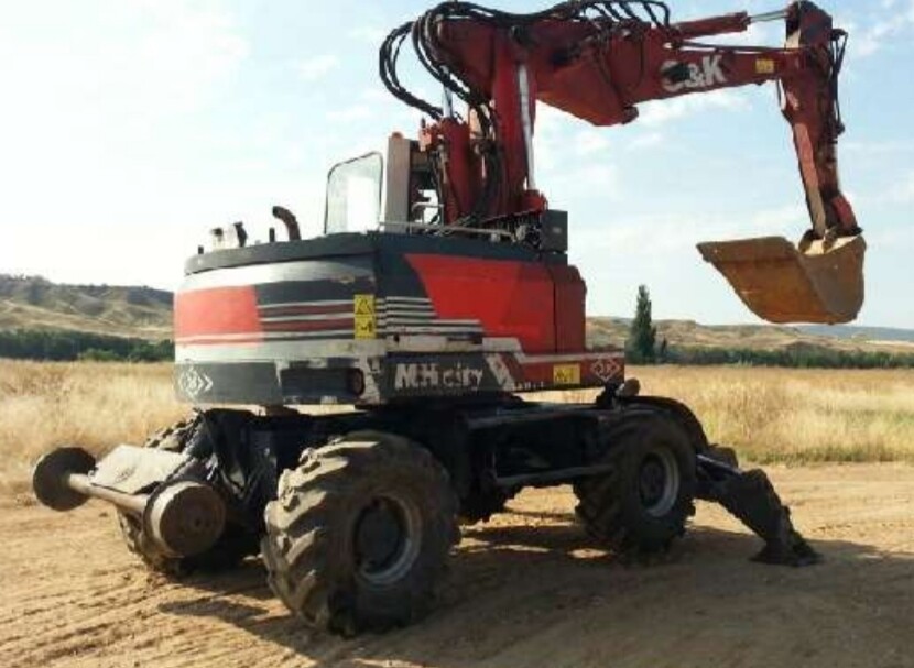 Retroexcavadora giratoria O&K MH CITY