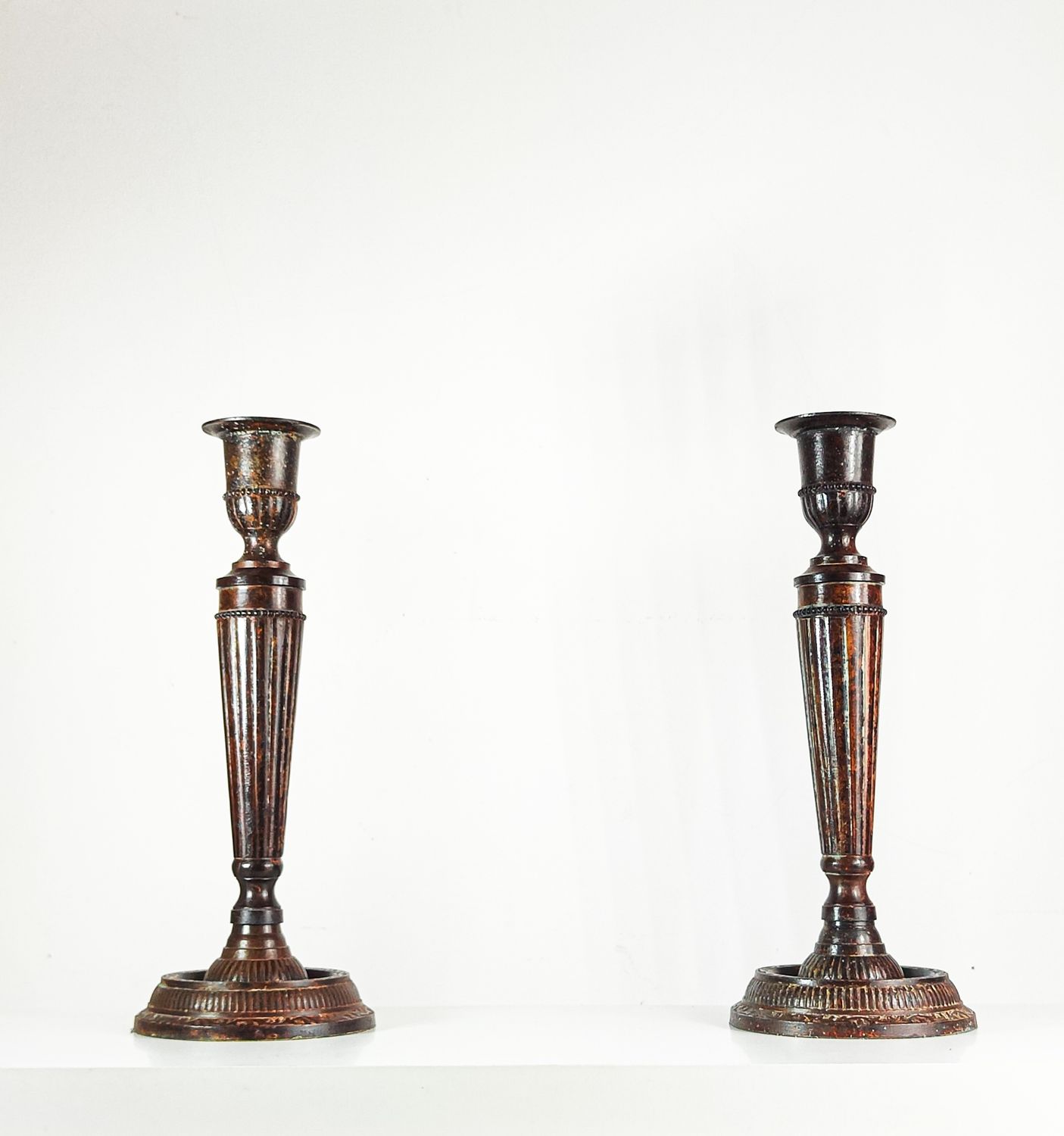 Pair of Antique Bronze Finished Fluted Candlesticks