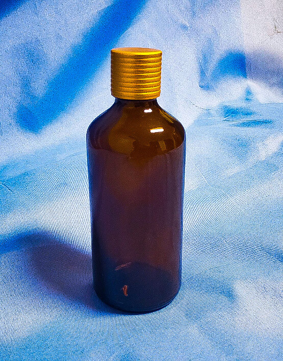 Amber Colored Container with Gold Aluminum Cap and Plug Glass Type