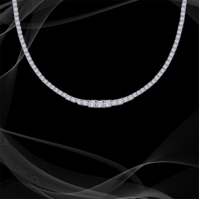 STERLING SILVER TENNIS NECKLACE WITH 15, CTS TOTAL WEIGHT OF SIMULATED DIAMONDS. 17" LONG.