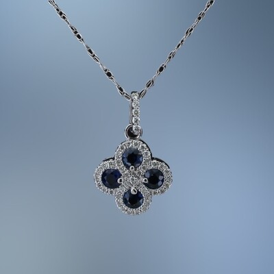 14KT WHITE GOLD SAPPHIRE AND DIAMOND PENDANT FEATURING 4 SAPPHIRES TOTALING .50 CTS AND 45 DIAMONDS TOTALING .20 CTS