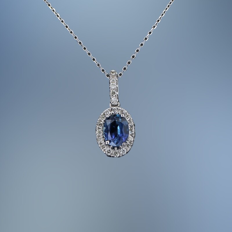 ​14KT WHITE GOLD DIAMOND & TANZANITE PENDANT FEATURING  1 OVAL TANZANITE TOTALING 0.56 CTS AND  21 ROUND BRILLIANT CUT DIAMONDS TOTALING 0.11 CTS