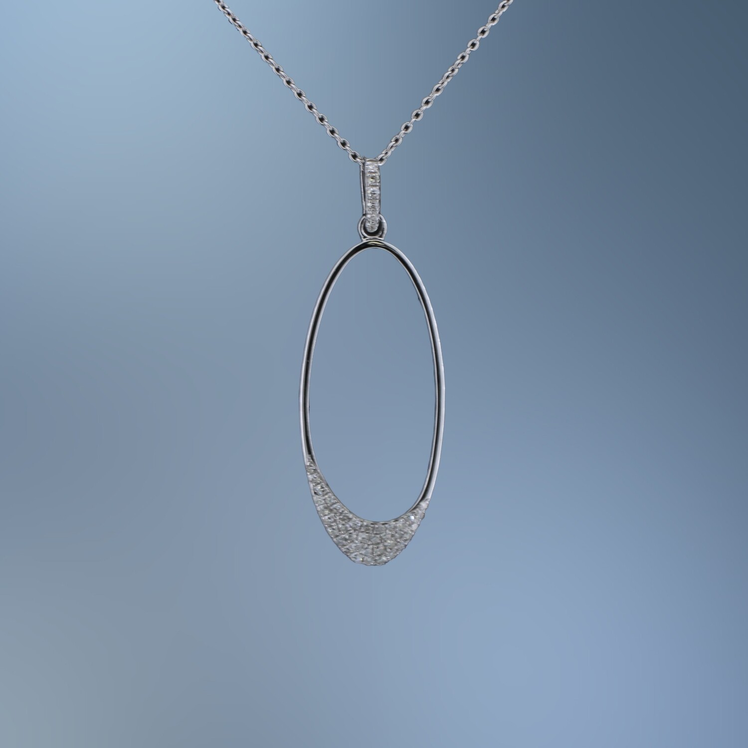14KT WHITE GOLD OVAL DIAMOND PENDANT FEATURING 43 ROUND BRILLIANT CUT DIAMONDS TOTALING 0.11 CTS