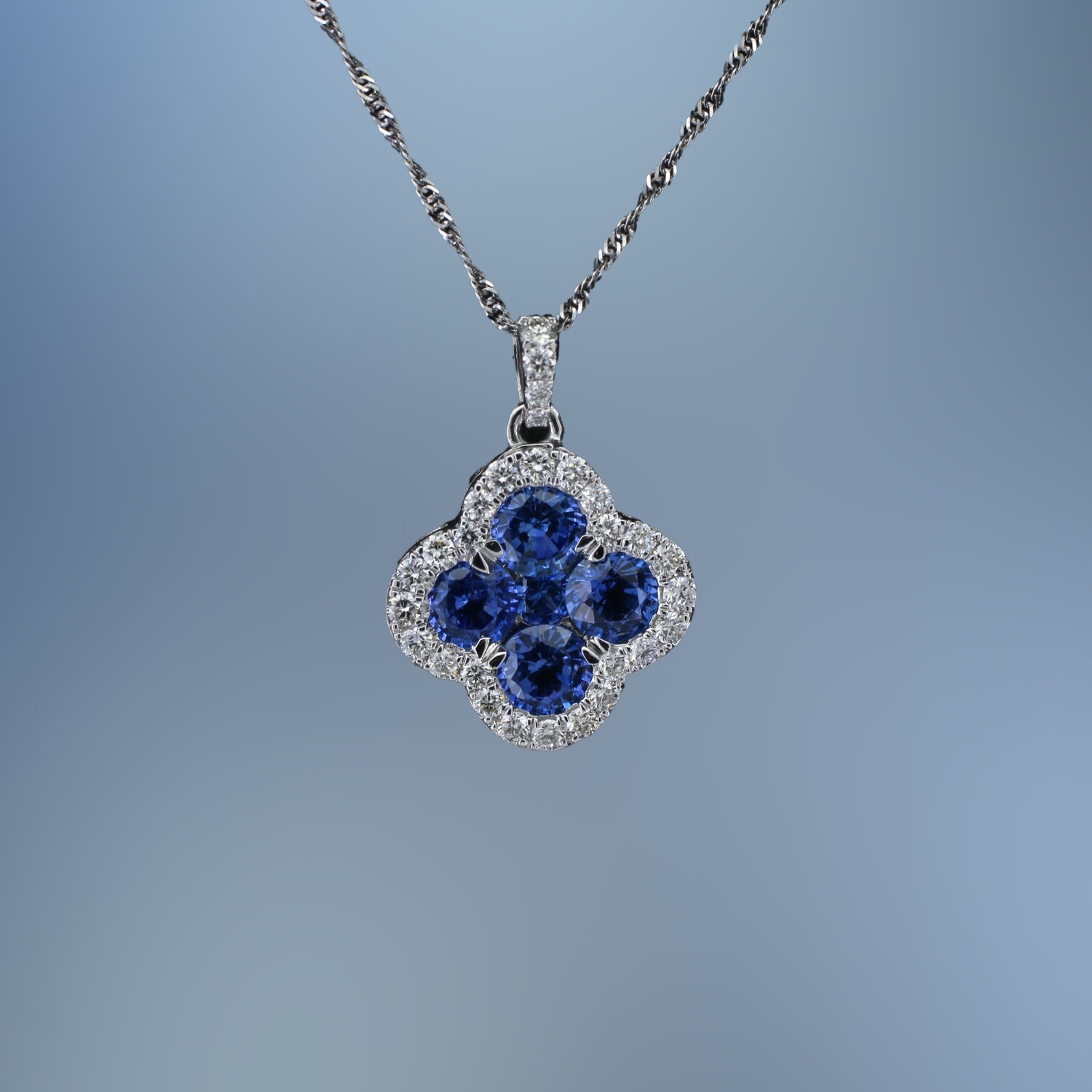 14KT WHITE GOLD SAPPHIRE & DIAMOND PENDANT FEATURING 5 SAPPHIRES TOTALING 1.92 CTS AND  28 ROUND BRILLIANT CUT DIAMONDS TOTALING .46 CTS