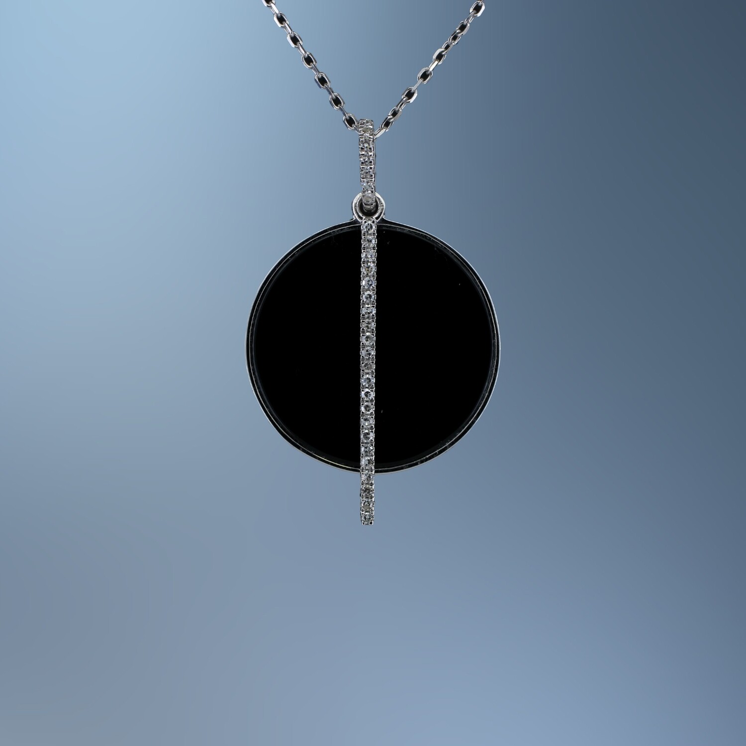 14KT WHITE GOLD BLACK ONYX AND DIAMOND PENDANT FEATURING ROUND BRILLIANT CUT DIAMONDS TOTALING .08 CTS WITH AN ADJUSTABLE 18 14KT WHITE GOLD BLACK ONYX AND DIAMOND PENDANT FEATURING ROUND BRILLIANT CUT DIAMONDS TOTALING .08 CTS WITH AN ADJUSTABLE 18" CHAIN.
