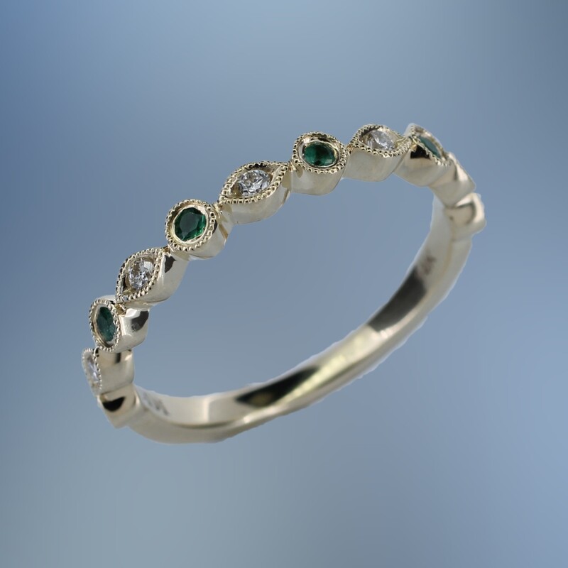 ONE 14KT YELLOW GOLD LADIES EMERALD AND DIAMOND RING CONTAINING .08 CTS. OF ROUND BRILLIANT CUT NATURAL DIAMONDS AND .18 CTS. OF ROUND BRILLIANT CUT EMERALDS