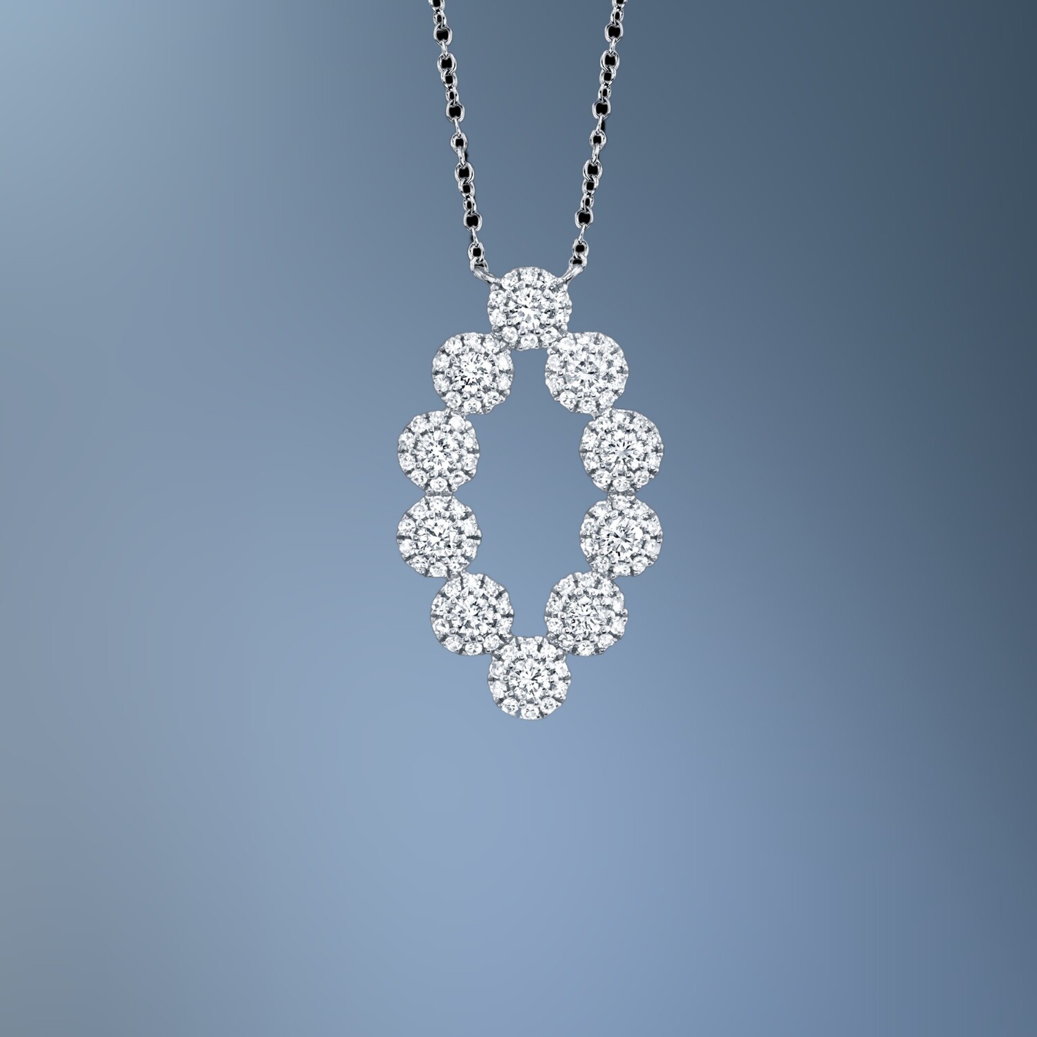 14KT WHITE GOLD OVAL DIAMOND PENDANT FEATURING 110 ROUND BRILLIANT CUT DIAMONDS TOTALING 0.61 CTS 14KT WHITE GOLD OVAL DIAMOND PENDANT FEATURING 110 ROUND BRILLIANT CUT DIAMONDS TOTALING 0.61 CTS