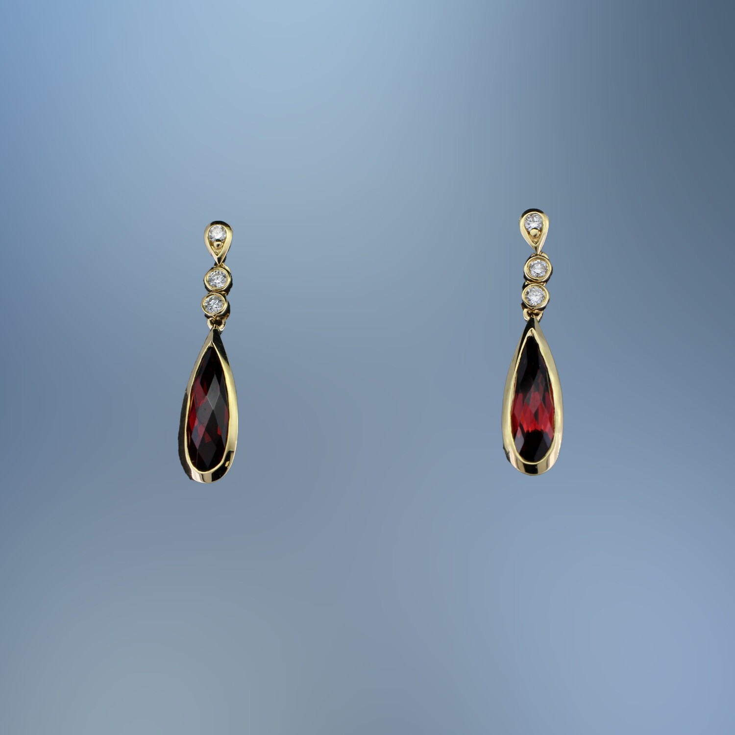 14KT YELLOW GOLD LADY'S EARRINGS FEATURING 2 FANTASY CUT GARNETS TOTALING 1.80 CTS AND 6 ROUND BRILLIANT CUT  DIAMONDS  TOTALING.10 CTS
