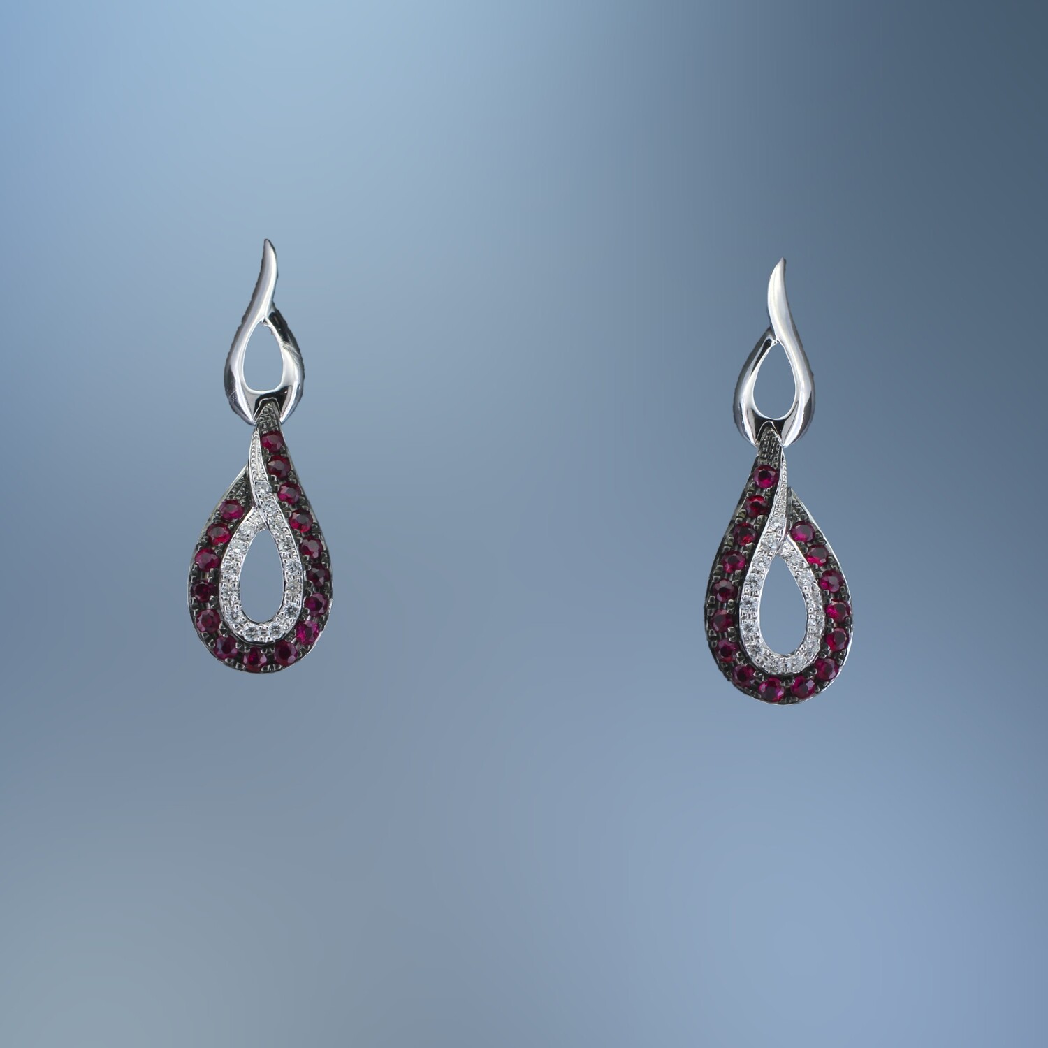 LADY'S RUBY AND DIAMOND EARRINGS FEATURING 32 ROUND BRILLIANT CUT RUBIES TOTALING  .29 CTS  AND 28 ROUND BRILLLIANT CUT DIAMONDS TOTALING .07 CTS