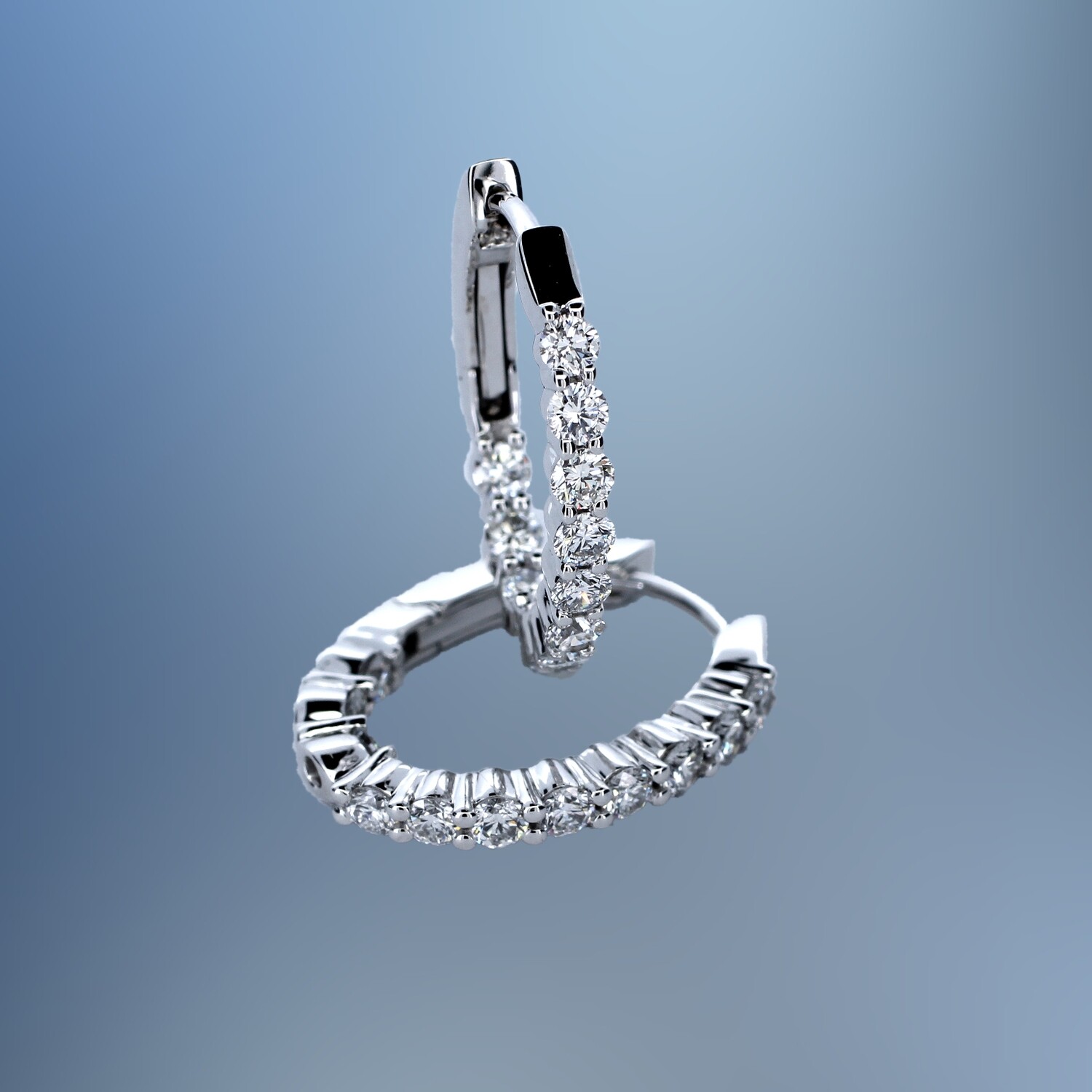 14KT WHITE GOLD OVAL DIAMOND INSIDE/OUT HOOP EARRINGS FEATURING 22 ROUND BRILLIANT DIAMONDS TOTALING 1.00 CTS 14KT WHITE GOLD OVAL DIAMOND INSIDE/OUT HOOP EARRINGS FEATURING 22 ROUND BRILLIANT DIAMONDS TOTALING 1.00 CTS