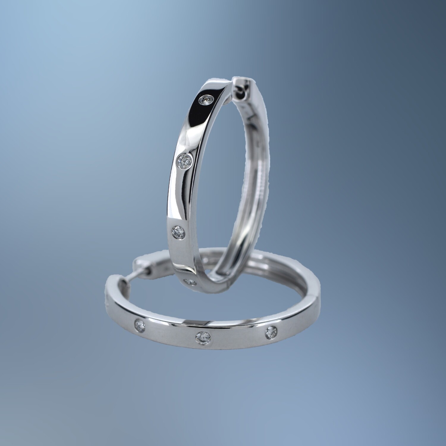 14KT WHITE GOLD LADY'S 1.00" DIAMOND HOOPS FEATURING 8 ROUND BRILLIANT CUT  DIAMONDS TOTALING .15CTS