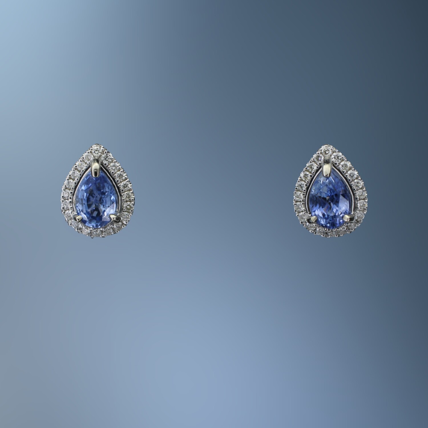14KT WHITE GOLD SAPPHIRE & DIAMOND EARRINGS FEATURING 1.31 CTS OF SAPPHIRES & 40 ROUND BRILLIANT DIAMONDS TOTALING .20 CTS 14KT WHITE GOLD SAPPHIRE & DIAMOND EARRINGS FEATURING 1.31 CTS OF SAPPHIRES & 40 ROUND BRILLIANT DIAMONDS TOTALING .20 CTS