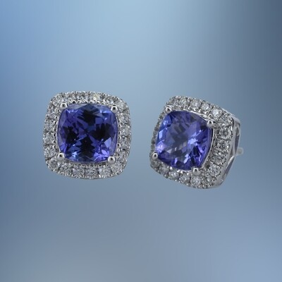 14 KT WHITE GOLD TANZANITE & DIAMOND STUD EARRINGS FEATURING 2 CUSHION CUT TANZANITES TOTALING 3.10 CTS AND 40 ROUND BRILLIANT CUT DIAMONDS TOTALING 0.50 CTS 14 KT WHITE GOLD TANZANITE & DIAMOND STUD EARRINGS FEATURING 2 CUSHION CUT TANZANITES TOTALING 3.10 CTS AND 40 ROUND BRILLIANT CUT DIAMONDS TOTALING 0.50 CTS