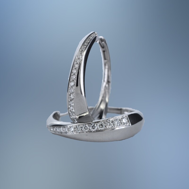 SC2943W ONE PAIR OF 14KT WG LADY'S DIAMOND HOOPS CONTAINING FORTY-EIGHT ROUND BRILLIANT DIAMONDS TOTALING .63 CTS. WITH A HINGE BACK CLOSURE.