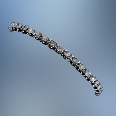 14KT WHITE GOLD 4 PRONG DIAMOND TENNIS BRACELET FEATURING 38 ROUND BRILLIANT CUT DIAMONDS TOTALING 7.00 CTS