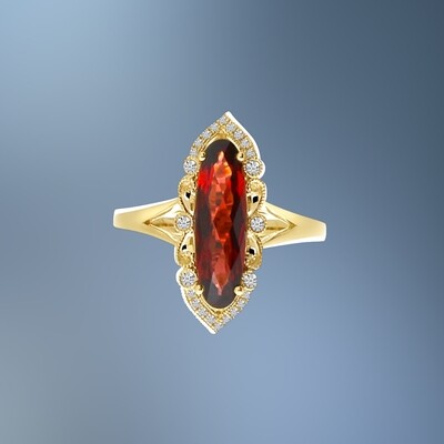 14KT YELLOW GOLD GARNET AND DIAMOND FASHION RING FEATURING A GARNET TOTALING 2.66 CTS AND 24 ROUND BRILLIANT CUT DIAMONDS TOTALING 0.14 CTS