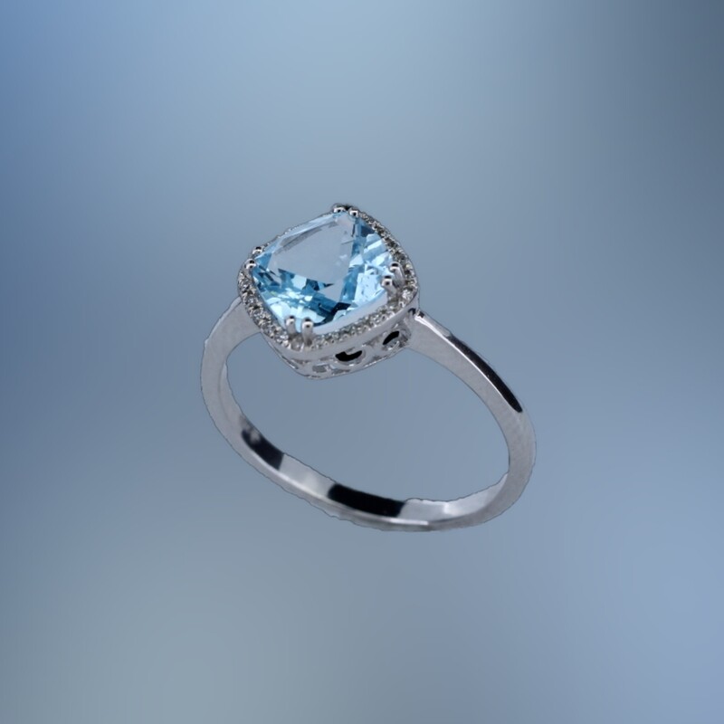 14KT WHITE GOLD FASHION RING FEATURING (1) CUSHION CUT 1.75 CT. BLUE TOPAZ AND 24 ROUND BRILLIANT CUT DIAMONDS TOTALING .07 CTS.