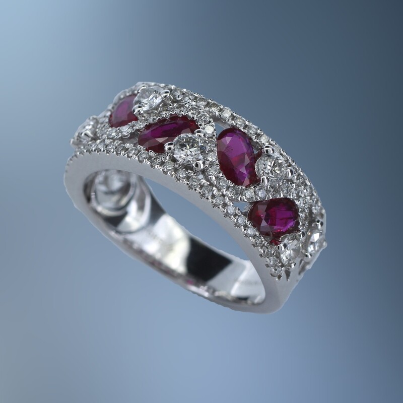 14KT WHITE GOLD FASHION RING FEATURING 5 OVAL BRILLIANT CUT RUBY'S TOTALING 1.10 CTS , AND 90 ROUND BRILLIANT CUT DIAMONDS TOTALING .86 CTS