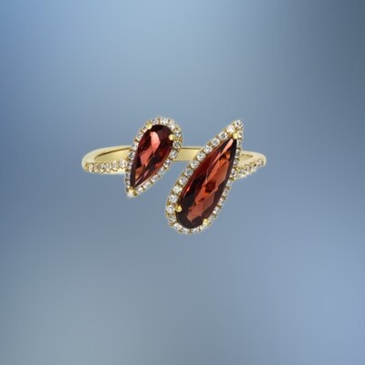 14KT YELLOW GOLD GARNET AND DIAMOND RING FEATURING 2 GARNETS TOTALING 1.80 CTS AND ROUND BRILLIANT CUT DIAMONDS TOTALING 0.29 CTS