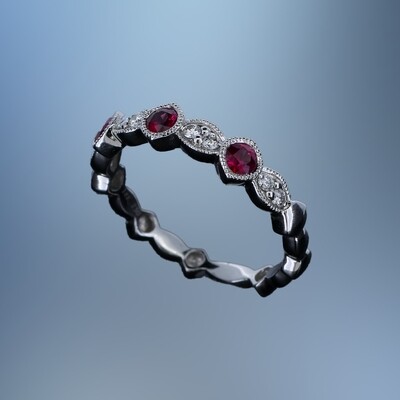 18KT WHITE GOLD DIAMOND & RUBY BAND FEATURING 3 ROUND RUBIES TOTALING .32 CTS & 8 ROUND BRILLIANT DIAMONDS TOTALING .11 CTS