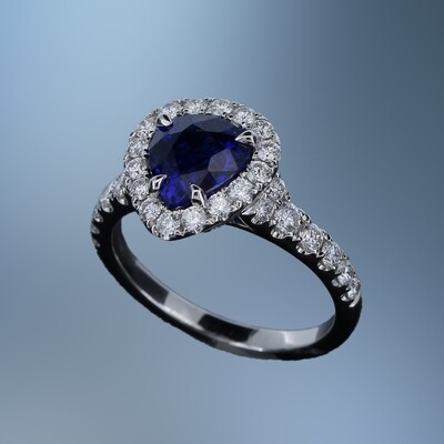 18KT WHITE GOLD DIAMOND & SAPPHIRE RING FEATURING ONE 1.98 CT PEAR SHAPE SAPPHIRE & 30 ROUND BRILLIANT DIAMONDS TOTALING .77 CTS