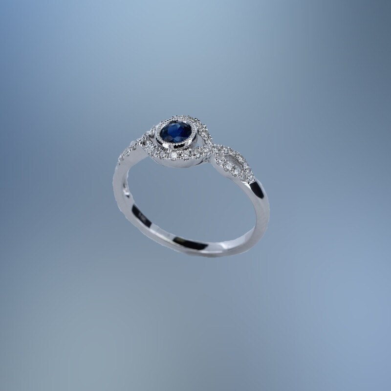 14KT WHITE GOLD DIAMOND & SAPPHIRE RING FEATURING  .22 CTS OF ROUND BRILLIANT DIAMONDS & ONE .40 CTS ROUND SAPPHIRE