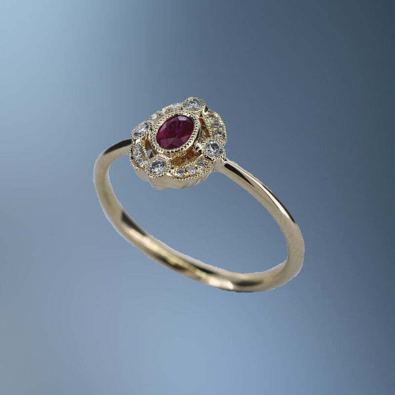 14KT YELLOW GOLD RUBY AND DIAMOND RING FEATURING ONE .18 CT. OVAL BRILLIANT CUT RUBY AND 16 ROUND BRILLIANT CUT DIAMONDS TOTALING .09 CTS.