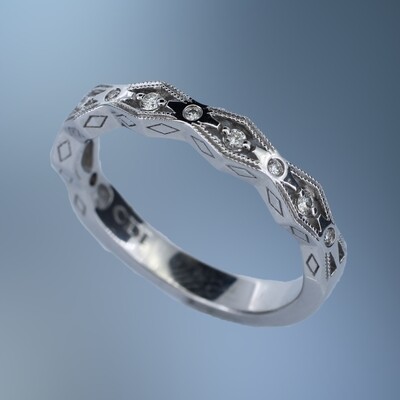 14KT WHITE GOLD DIAMOND ANNIVERSARY BAND FEATURING 11 ROUND BRILLIANT CUT DIAMONDS TOTALING 0.09 CTS
