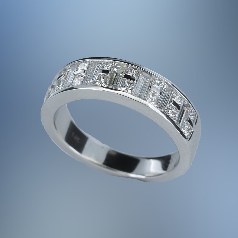 14KT WHITE GOLD DIAMOND BAND FEATURING 16 PRINCESS CUT DIAMONDS TOTALING .49 CTS & 7 BAGUETTE DIAMONDS TOTALING .55 CTS