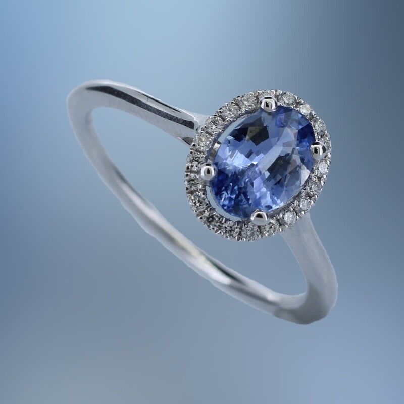 18KT WHITE GOLD DIAMOND & SAPPHIRE RING FEATURING 1 OVAL SAPPHIRE TOTALING 0.89 CTS AND 20 ROUND BRILLIANT CUT DIAMONDS TOTALING .10 CTS