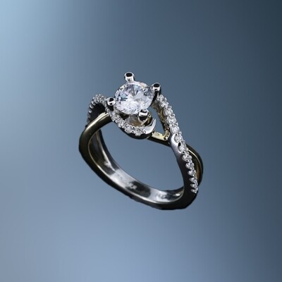 14 KT TWO TONE ENGAGEMENT RING FEATURING 32 ROUND BRILLIANT CUT DIAMONDS TOTALING 0.39 CTS.
