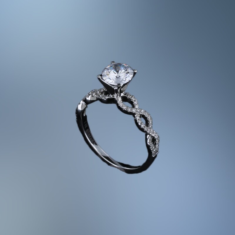14KT WHITE GOLD  ENGAGEMENT RING FEATURING 60 ROUND BRILLIANT CUT DIAMONDS TOTALING 0.18 CTS.