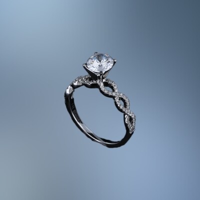 14KT WHITE GOLD ENGAGEMENT RING FEATURING 60 ROUND BRILLIANT CUT DIAMONDS TOTALING 0.18 CTS.