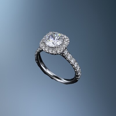 14K WHITE GOLD HALO STYLE ENGAGEMENT RING FEATURING 32 ROUND BRILLIANT CUT DIAMONDS TOTALING 0.69 CTS.