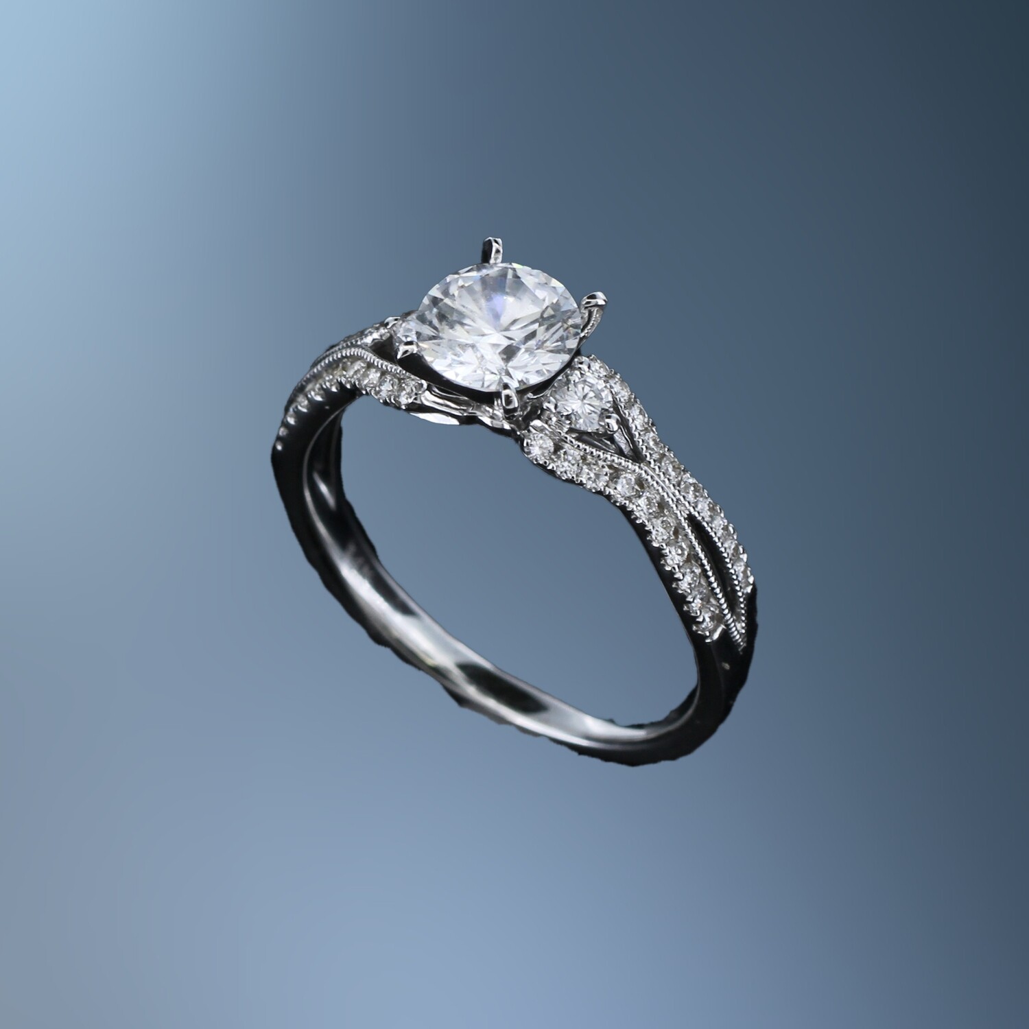 14KT WHITE GOLD ENGAGEMENT RING FEATURING 42 ROUND BRILLIANT CUT DIAMONDS TOTALING 0.33CTS