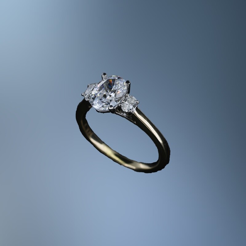 14KT YELLOW  GOLD ENGAGEMENT RING FEATURING 2 OVAL DIAMONDS TOTALING .19 CTS