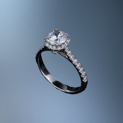 14 KT WHITE GOLD HALO STYLE ENGAGEMENT RING FEATURING 34 ROUND BRILLIANT CUT DIAMONDS TOTALING 0.33 CTS.