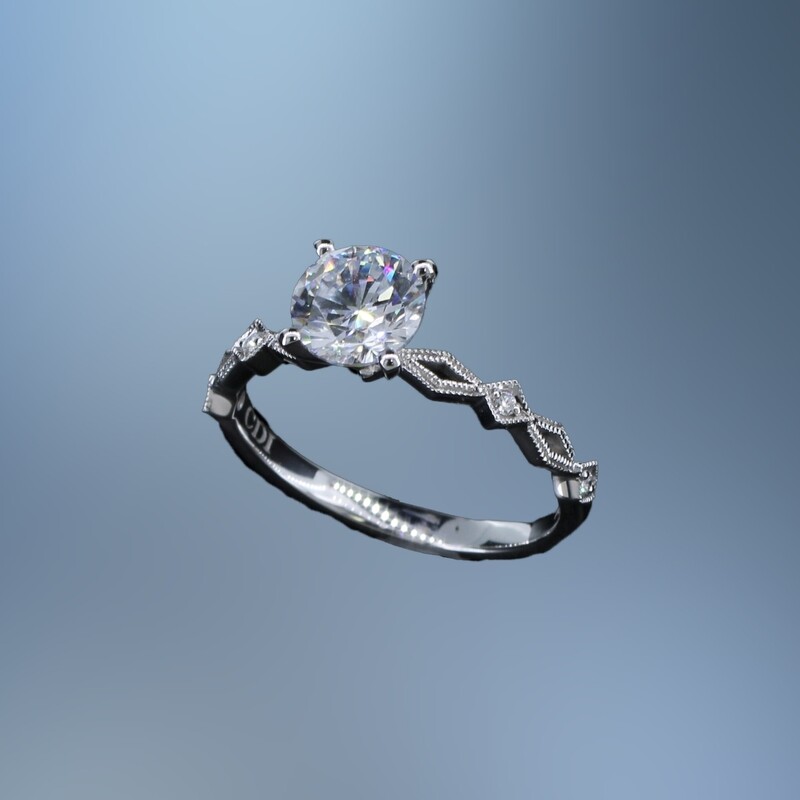 14KT WHITE GOLD ENGAGEMENT RING FEATURING 4 ROUND BRILLIANT CUT DIAMONDS TOTALING  0.03 CTS.