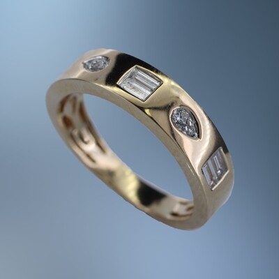 ONE 14KT YELLOW GOLD LADIES FASHION RING CONTAINING .07 CTS. OF NATURAL ROUND BRILLIANT CUT DIAMONDS AND .18 CTS OF NATURAL STRAIGHT BAGUETTES.