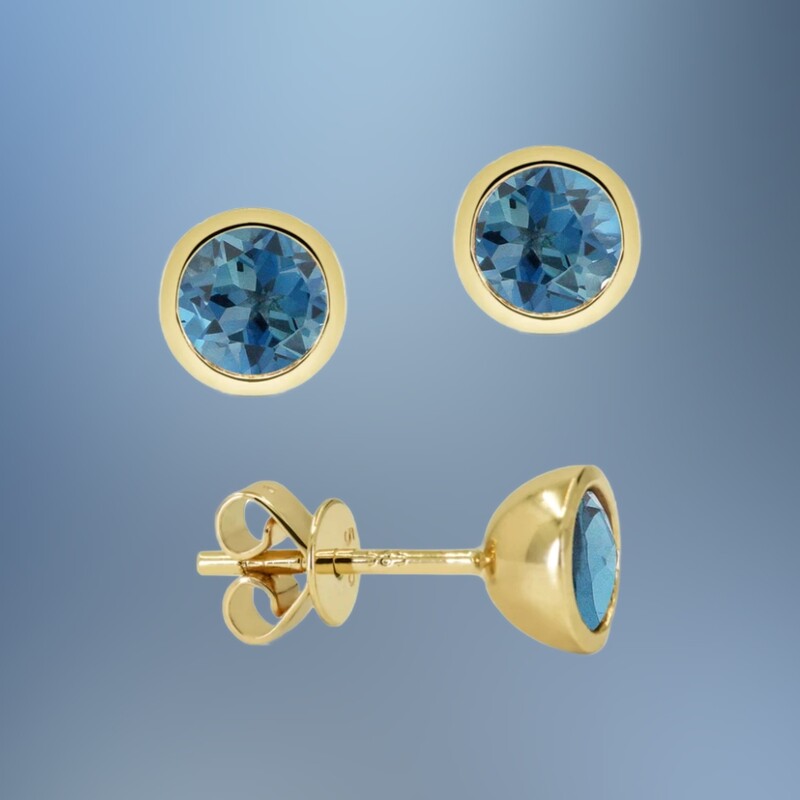 14 KARAT YELLOW GOLD BEZEL SET BLUE TOPAZ STUD EARRINGS CONTAINING TWO ROUND BLUE TOPAZ TOTALING 1.24 CARATS
