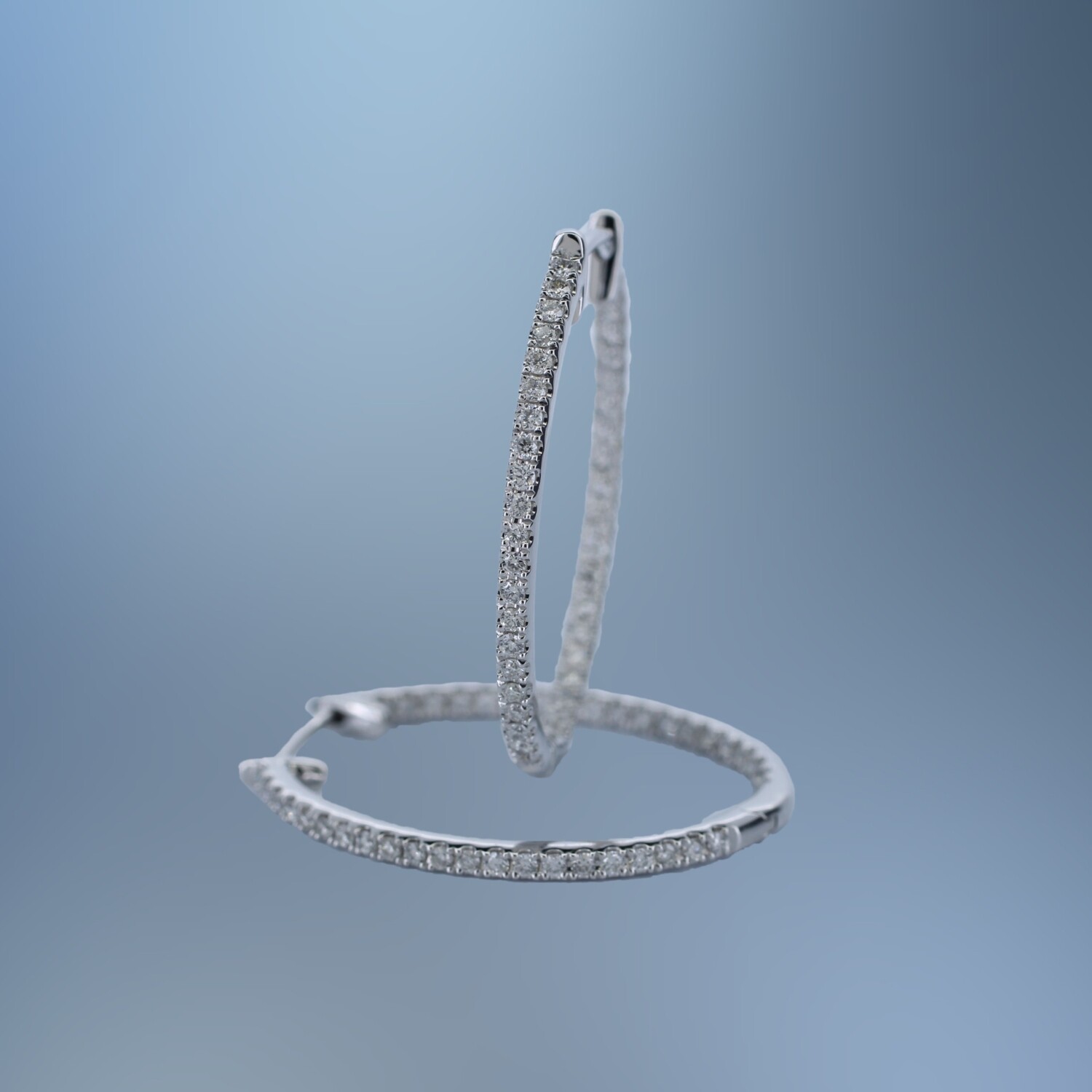14KT WHITE GOLD INSIDE & OUT OVAL DIAMOND HOOP EARRING CONTAINING 82 NATURAL ROUND BRILLIANT DIAMONDS TOTALING .41 CTS 14KT WHITE GOLD INSIDE & OUT OVAL DIAMOND HOOP EARRING CONTAINING 82 NATURAL ROUND BRILLIANT DIAMONDS TOTALING .41 CTS