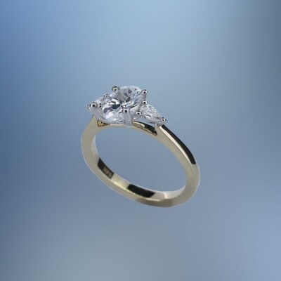 ONE 14KT YELLOW AND WHITE GOLD DIAMOND ENGAGEMENT RING CONTAINING TWO PEAR SHAPE DIAMONDS, TOTALING .20 CTS.