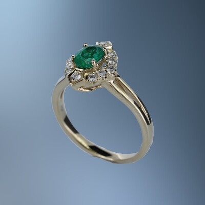 14 KARAT YELLOW GOLD EMERALD AND DIAMOND FASHION RING CONTAINING 1 OVAL SHAPE EMERALD WEIGHING 0.56 CARATS AND 12 ROUND BRILLIANT CUT DIAMONDS WEIGHING 0.24 CARATS