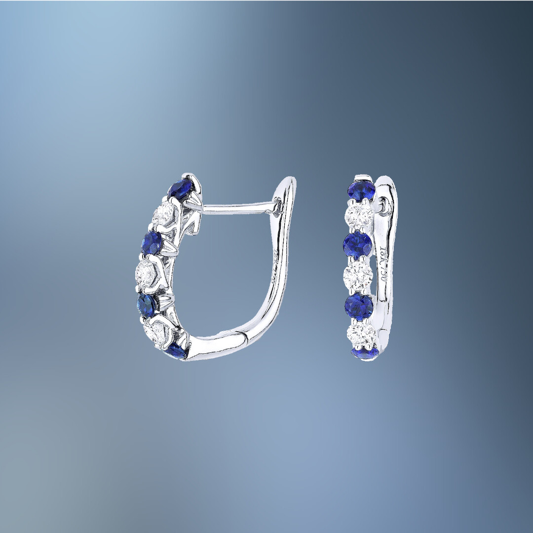 14 KARAT WHITE GOLD NATURAL BLUE SAPPHIRE AND DIAMOND HOOP EARRINGS CONTAINING 8 NATURAL ROUND BLUE SAPPHIRES TOTALING 0.48 CARATS AND 6 NATURAL ROUND BRILLIANT CUT DIAMONDS TOTALING 0.31 CARATS 14 KARAT WHITE GOLD NATURAL BLUE SAPPHIRE AND DIAMOND HOOP EARRINGS CONTAINING 8 NATURAL ROUND BLUE SAPPHIRES TOTALING 0.48 CARATS AND 6 NATURAL ROUND BRILLIANT CUT DIAMONDS TOTALING 0.31 CARATS