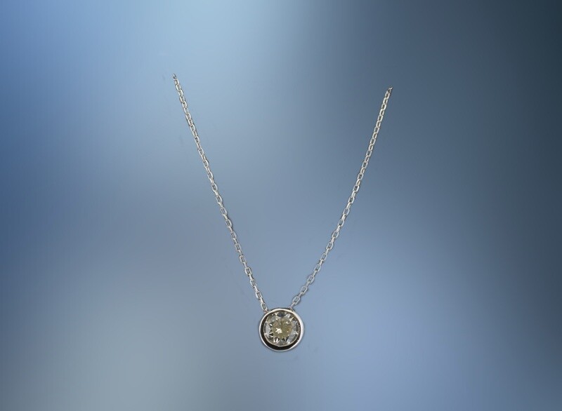 ONE 18KT WHITE GOLD LADIES BEZEL SET DIAMOND PENDANT CONTAINING ONE .31 CT NATURAL ROUND BRILLIANT CUT DIAMOND ON A 17" ADJUSTABLE CHAIN.