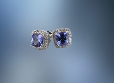ONE PAIR OF 14KT WHITE GOLD LADIES DIAMOND AND TANZANITE EARRINGS CONTAINING TWO CUSHION CUT TANZANITES TOTALING .95 CTS, AND .17 CTS OF NATURAL ROUND BRILLIANT CUT DIAMONDS, WITH A POST BACK ONE PAIR OF 14KT WHITE GOLD LADIES DIAMOND AND TANZANITE EARRINGS CONTAINING TWO CUSHION CUT TANZANITES TOTALING .95 CTS, AND .17 CTS OF NATURAL ROUND BRILLIANT CUT DIAMONDS, WITH A POST BACK