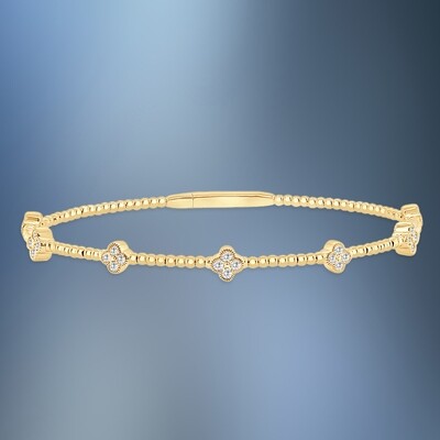 ONE 14KT WHITE AND YELLOW GOLD DIAMOND FLEXIBLE BANGLE CONTAINING .48 CTS. OF NATURAL ROUND BRILLIANT CUT DIAMONDS